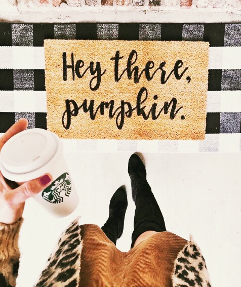 Girl holding Starbucks cup